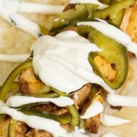 Chipotle Chicken Tacos · 3 Pulled Chipotle Chicken Tacos, Pickled Poblano Peppers, Cilantro Sour Cream