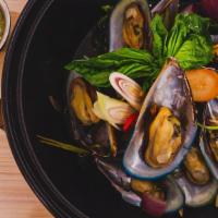 Hoi Oab · Steamed mussels with lemongrass, galangal, lime leaves, red onion, and basil in citrusy fish...
