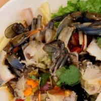 Yum Poo Ma · Green mango salad with marinated fresh blue crab, red onion, tomato, cashew nuts and cilantr...
