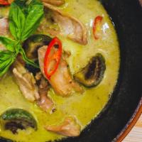 Green Curry · Chicken in coconut green curry sauce with Thai eggplant, red pepper, and basil