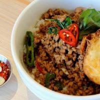 Kra Prow · Stir-fried ground pork with fresh chili, long hot pepper, red pepper, and basil over rice to...