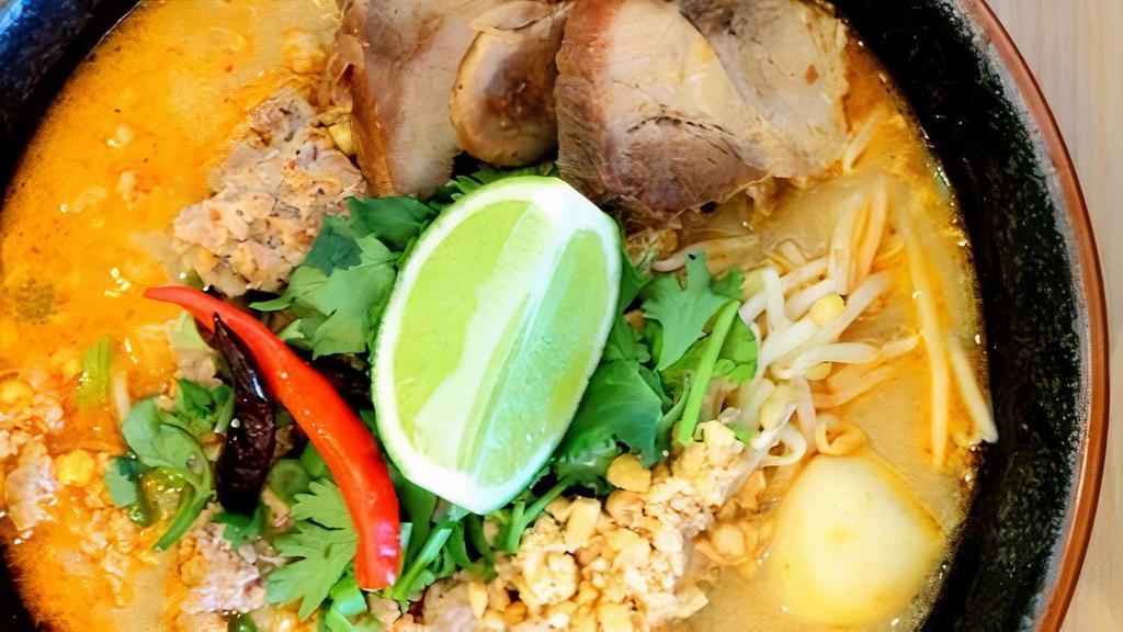 Tom Yum Noodles Soup · Choice of noodles with roasted pork, ground pork, fish balls, bean sprouts, scallion, cilantro, and peanuts in spicy creamy Tom Yum broth
