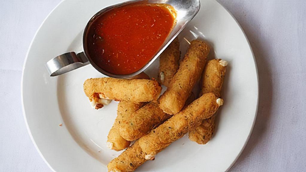 Mozzarella Sticks · Deep fried cheese sticks. Crispy on the outside, gooey on the inside. Virtually guaranteed to be a table favorite! Served with a side of marinara sauce.