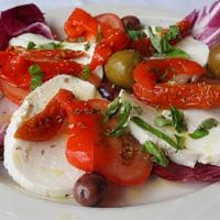 Lg Mozzarella Caprese Salad · Sliced tomatoes, fresh mozzarella, roasted peppers, basil & olives drizzled with EVOO.