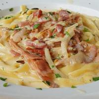 Fettuccini Carbonara · Caramelized onions & bacon in cream sauce.