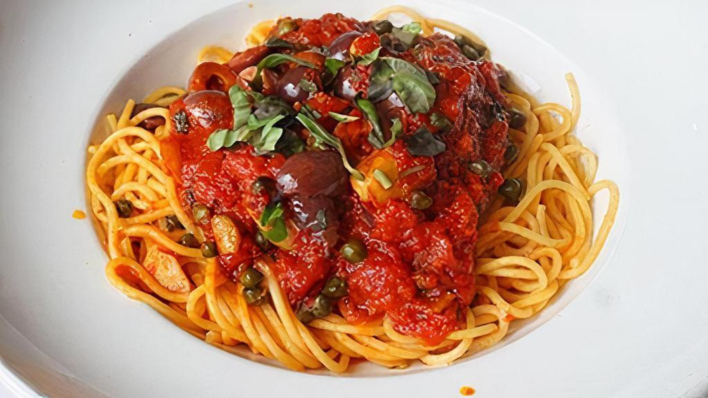 Capellini Puttanesca · Marinara sauce with black olives, capers & anchovies.