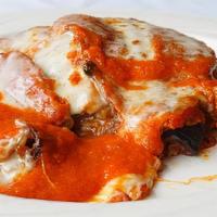 Eggplant Parmigiana · Breaded, fried & topped with tomato sauce and melted mozzarella.