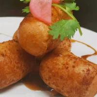 Rice Bomb · Deep fried homemade glutinous rice with tiger brown sugar syrup on the side (4 pcs/ ea)