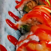 Kamikaze Roll · (Spicy crunchy white tuna, apple, avocado inside, topped with salmon, black masago& special ...