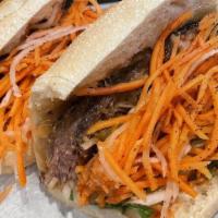 Short Ribs Banh Mi · Braised short rib pineapple chili coulis with bean sprout and basil (no mayo), cucumber, cil...