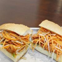 Crispy Chicken Banh Mi · Beer batter chicken breast with mayo dressing, cucumber, cilantro, pickled daikon and carrot.