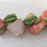 Rainbow Roll · Crab, cucumber and avocado inside, variety kind of fish outside.