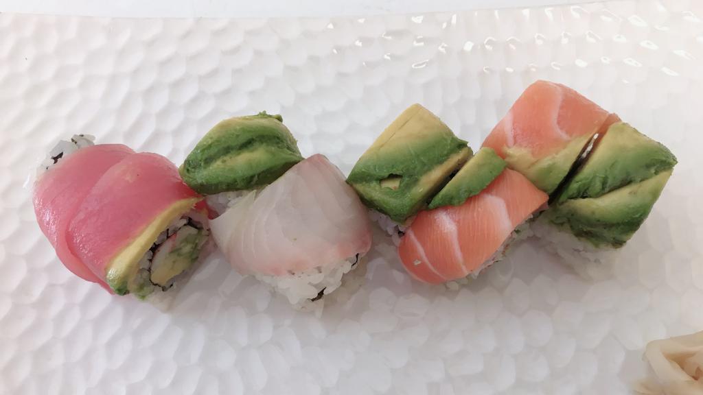 Rainbow Roll · Crab, cucumber and avocado inside, variety kind of fish outside.