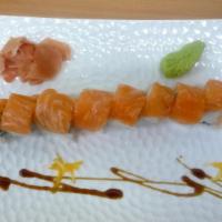 Pink Lady Roll · Spicy crunchy salmon inside fresh salmon on top.