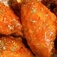 Cl Chicken Wings · Deep-fried seasoned chicken wings coated with any of our sauces: Honey BBQ, Jerk Sauce, Lemo...