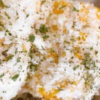 El Paso Loaded Corn · Corn on the cob topped with mayo, parsley, feta cheese & parmesan cheese.