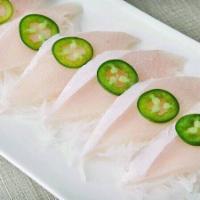 Yellowtail Jalapeno · With jalapeno drizzled in ponzu sauce