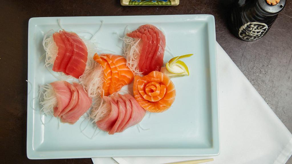 Tricolor Sashimi Deluxe · 7 pcs tuna,  7  pcs salmon, 7 pcs yellowtail sashimi with a bowl of rice