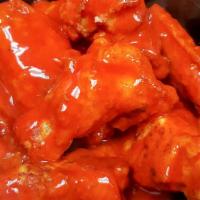 Buffalo Chicken Wings · Eight pieces oven roasted wings with a hot buffalo sauce. 560 cal.