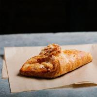 Almond Croissant · A buttery croissant filled with almond paste and  sprinkled with flaked almonds.
