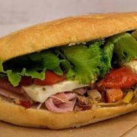 Italian · Ham, prosciutto, spicy goathorn peppers, roasted tomatoes, and marinated olives on our Tusca...