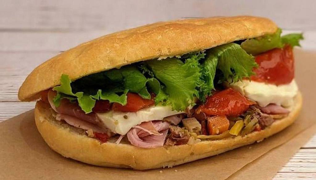 Italian · Ham, prosciutto, spicy goathorn peppers, roasted tomatoes, and marinated olives on our Tuscan sandwich bread.
