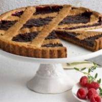 Vegan Elderberry Raspberry Tart · A multigrain tart shell filled with elderberry and raspberry marmalade. Vegan.