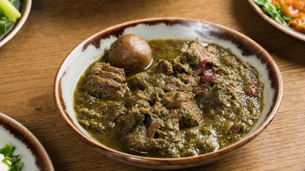 Ghourmeh Sabzi Dinner · Parsley and scallions simmered with chunks of beef, red kidney beans, and dried lemons. Served with white rice.