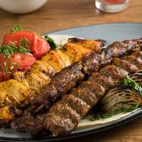 Combination Platter Dinner · One skewers of barg, one skewer of jujeh kabob, and Two skewers of koobideh kebob.  Served w...