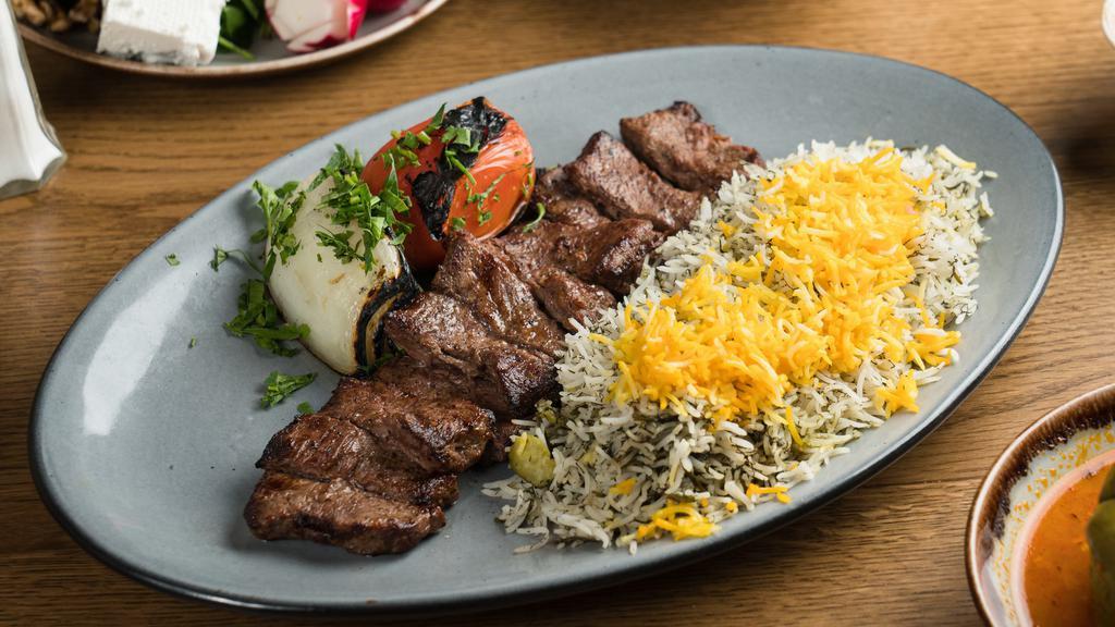 Barg Kebob Dinner · Juicy strips of sirloin marinated in a special age-old recipe. Served with basmati rice, grilled onion, and tomato.