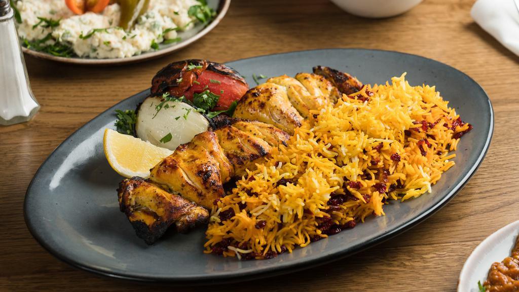 Jujeh Kebob Dinner · Pieces of the bone-in Cornish hen in our lemon saffron marinade; char-grilled to perfection. Served with basmati rice, grilled onion, and tomato.