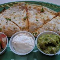 Slow-Simmered Black Beans Quesadillas · Guacamole, sour cream and pico de gallo on the side.