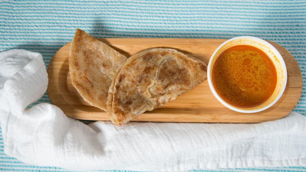 #1. Malaysian Homemade Roti Canai · Spicy. Malaysian crispy Indian style pancake served with curry chicken and potato dipping sauce.