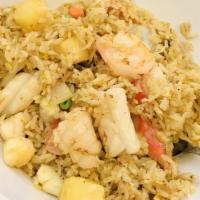 #99. Pineapple Seafood Fried Rice · Fried Rice with Mix seafood with Pineapple chucks, eggs, peas, carrots, & onions