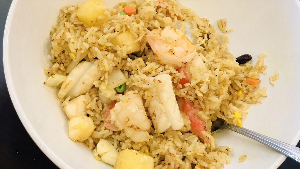 #99. Pineapple Seafood Fried Rice · Fried Rice with Mix seafood with Pineapple chucks, eggs, peas, carrots, & onions