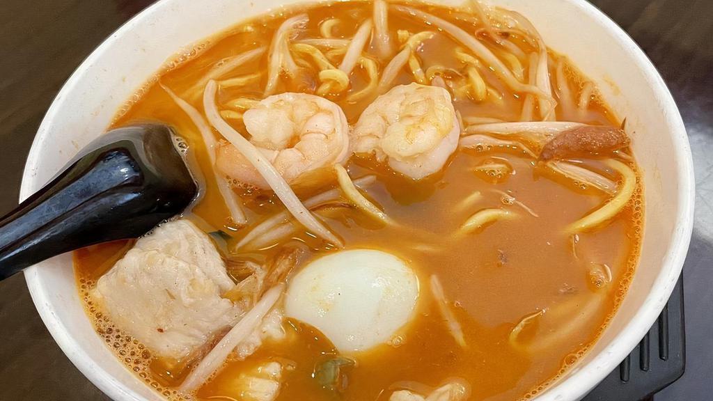 #125. Prawn Mee · Spicy. Round egg noodles with shrimp, chicken, kang Kung (water spinach), bean sprouts, and half of a hard boiled egg in a shrimp spicy broth soup.