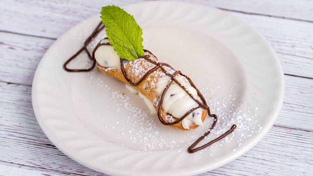 Classic Large Cannoli · Tube-shaped shells of fried dough filled with creamy stuffed ricotta impastata blended with mini chocolate morsels.