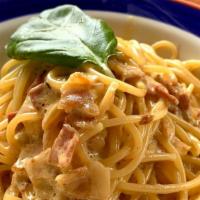 Spaghetti Alla Carbonara · Pancetta (Italian bacon) and light cream sauce.