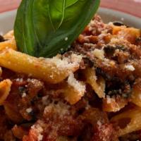 Penne Alla Bolognese · Homemade meat sauce with carrots, celery, onions, and tomato sauce.
