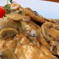 Chicken Marsala · Mushrooms, marsala wine, and a side of mashed potatoes.
