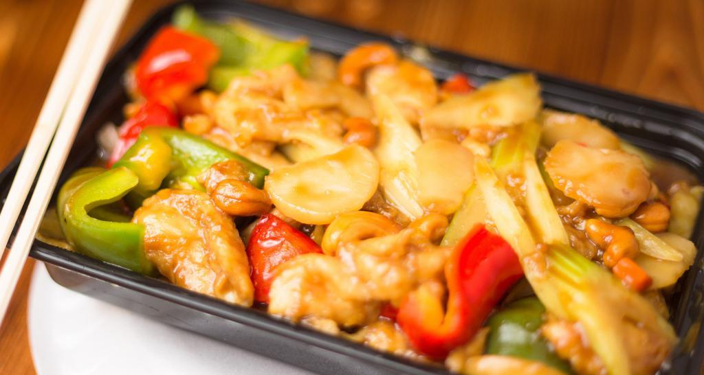 Cashew Chicken · Served with fried rice and egg roll.