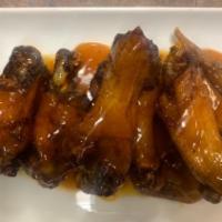 Brown Sugar Wings · 5 wings  served with fries in our  brown sugar sauce,