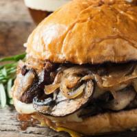 Bedrock Burger · Juicy beef patty with cheese and mushrooms on a bun.