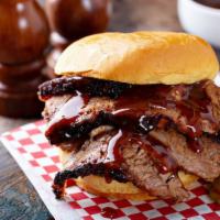 Texan Burger · Juicy beef patty with cheddar cheese, turkey bacon and BBQ sauce on a bun.