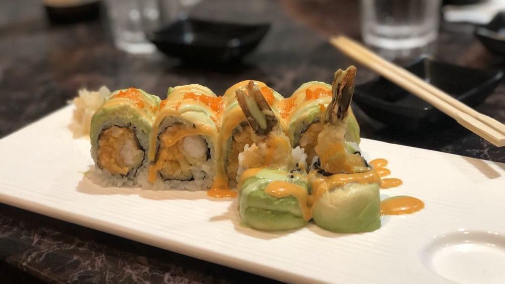 Tiger Roll · Spicy salmon, crunchy cucumber inside topped with fresh yellowtail, avocado and wasabi, mayo, wasabi tobiko.