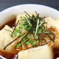 Age Tofu · Deep fried tofu with tempura sauce , topped with bonito flake