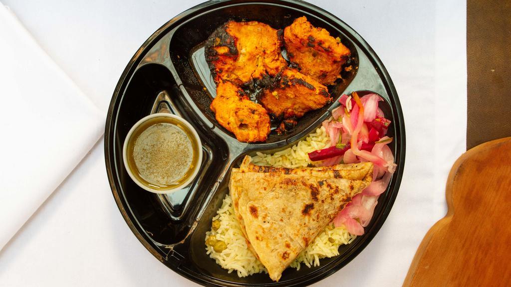 Chicken Tikka Kebab · Served with salad, rice and bread.