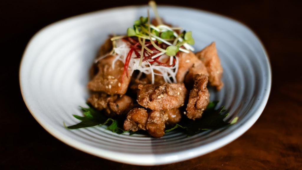 Ginger Chicken Kara-Age · Flash fried, marinated and tender boneless chicken thigh seasoned with sesame seeds and tossed in a sweet chili soy sauce.