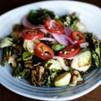 Crispy Brussels Sprouts · Vegetarian, spicy. Tossed with candied walnuts, chilies, mint, pickled onions, and Spicy Gar...