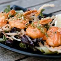 Spicy Garlic Prawns · Spicy. Flash fried served over local field greens with a sweet chili soy and spicy garlic ai...